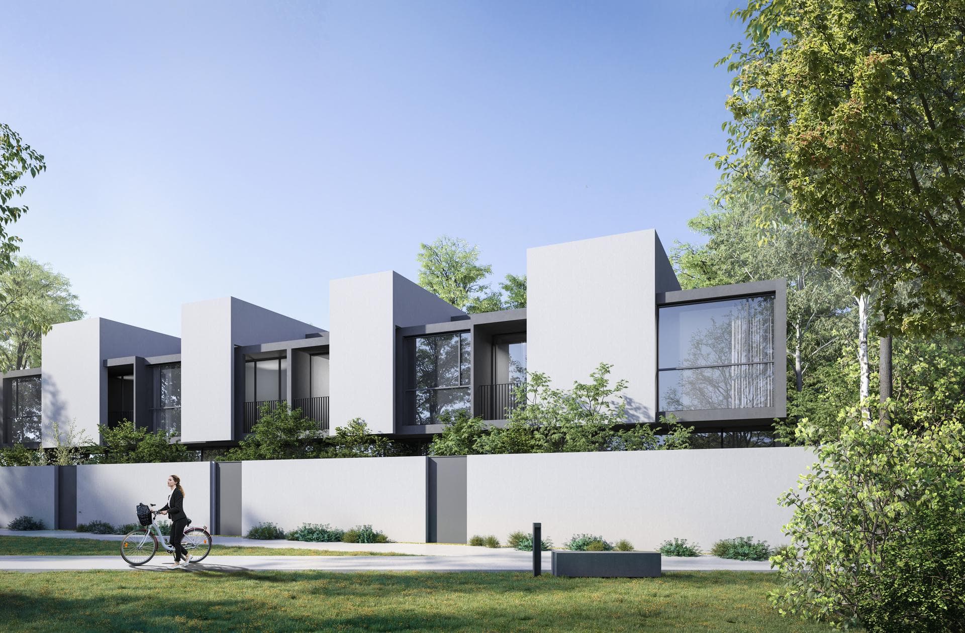 Private garden courtyard at a Masaar townhouse surrounded by greenery