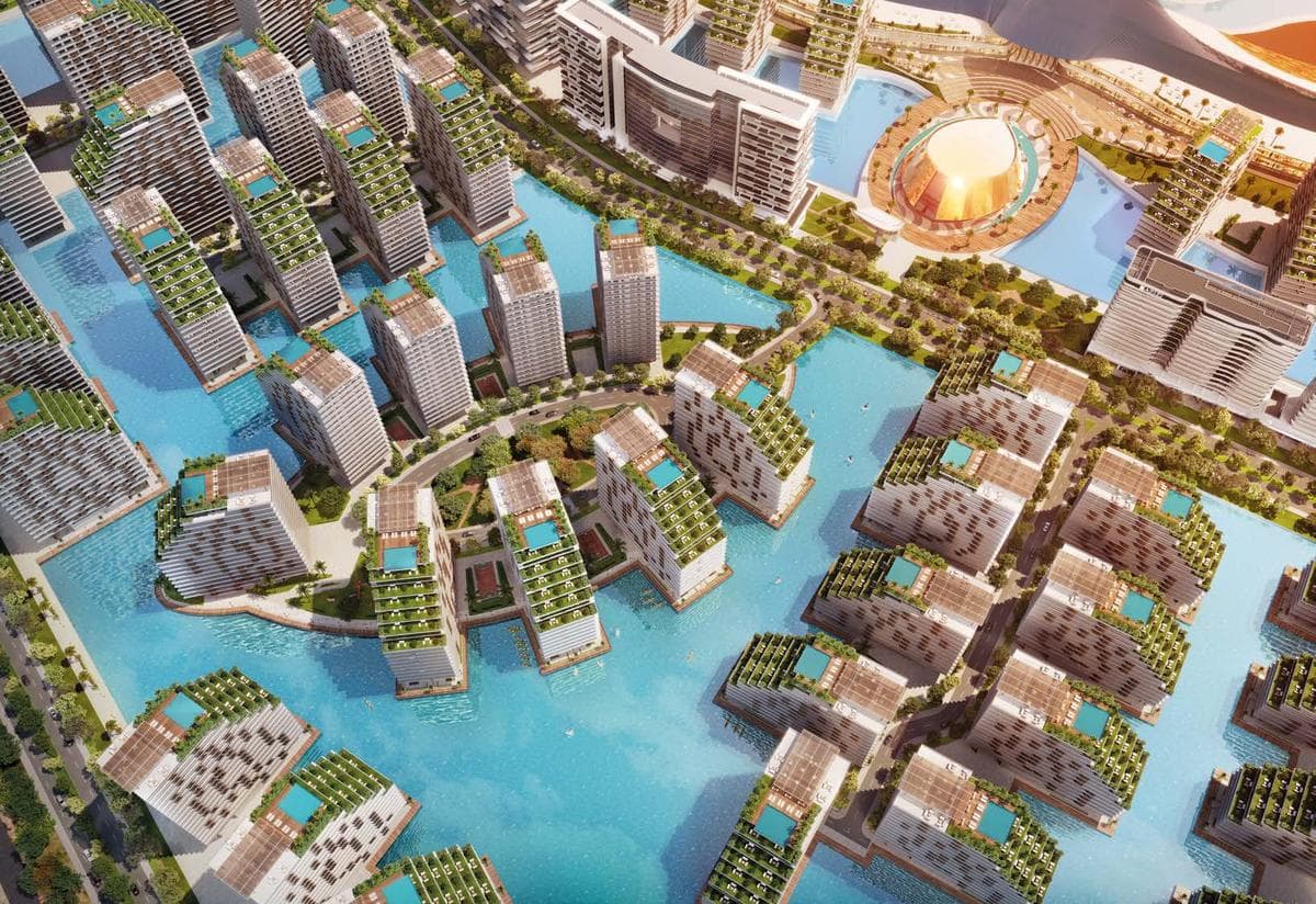 Azizi Venice residential buildings surrounding the community lagoon and resort-style pool